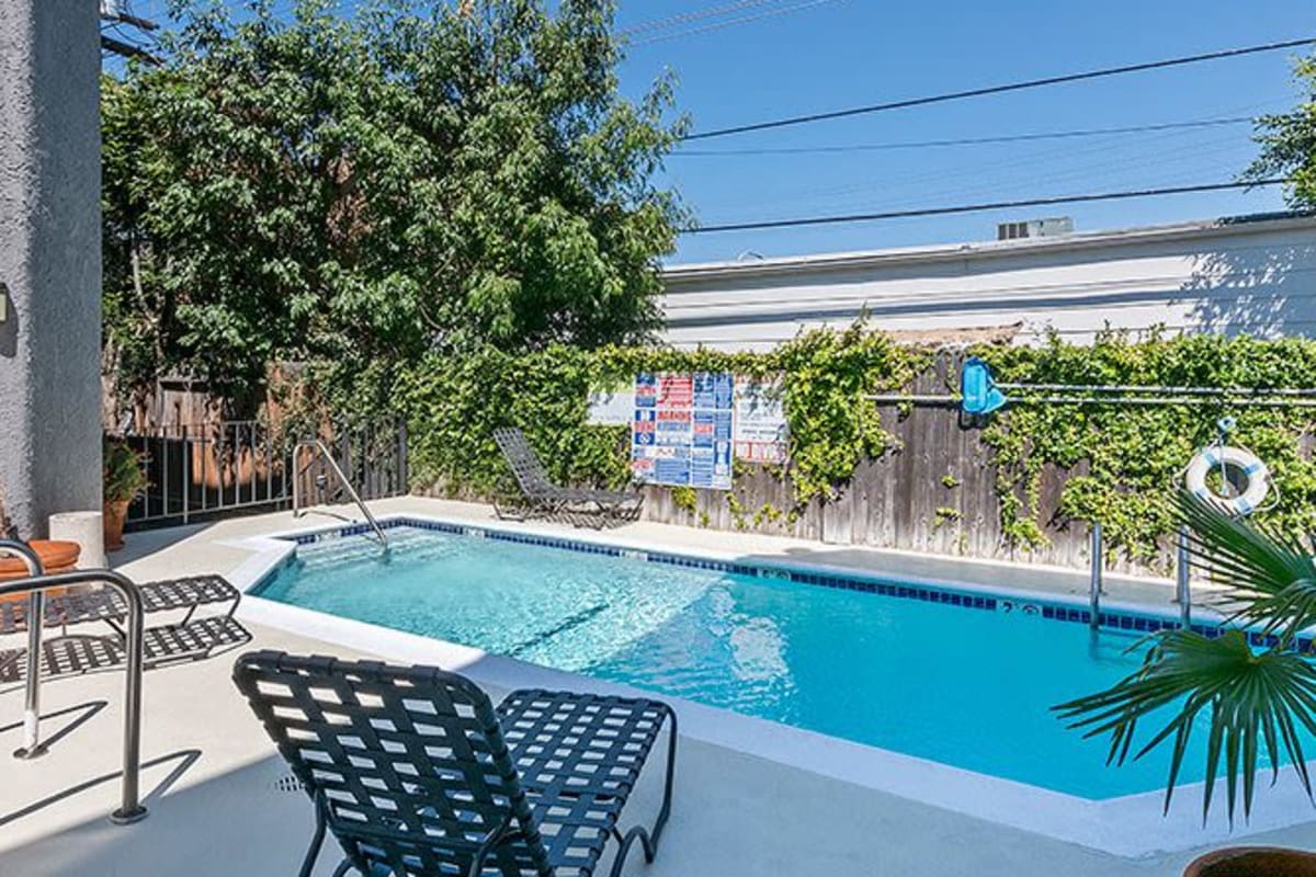 Pool with lounge chairs at Villa Bianca, West Hollywood, California