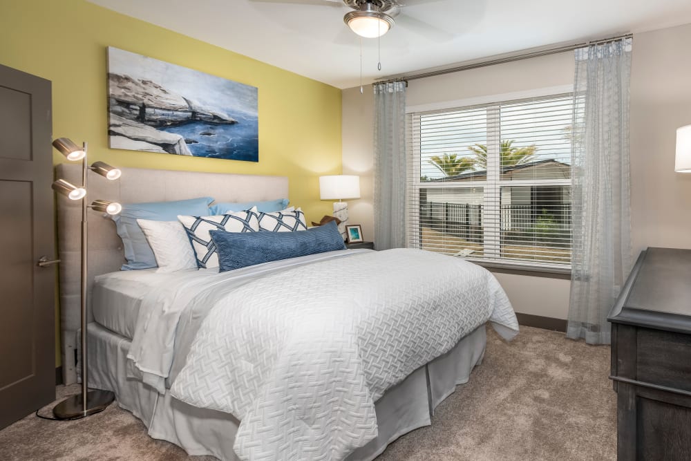 A large bedroom with plush carpeting at Olympus Emerald Coast in Destin, Florida