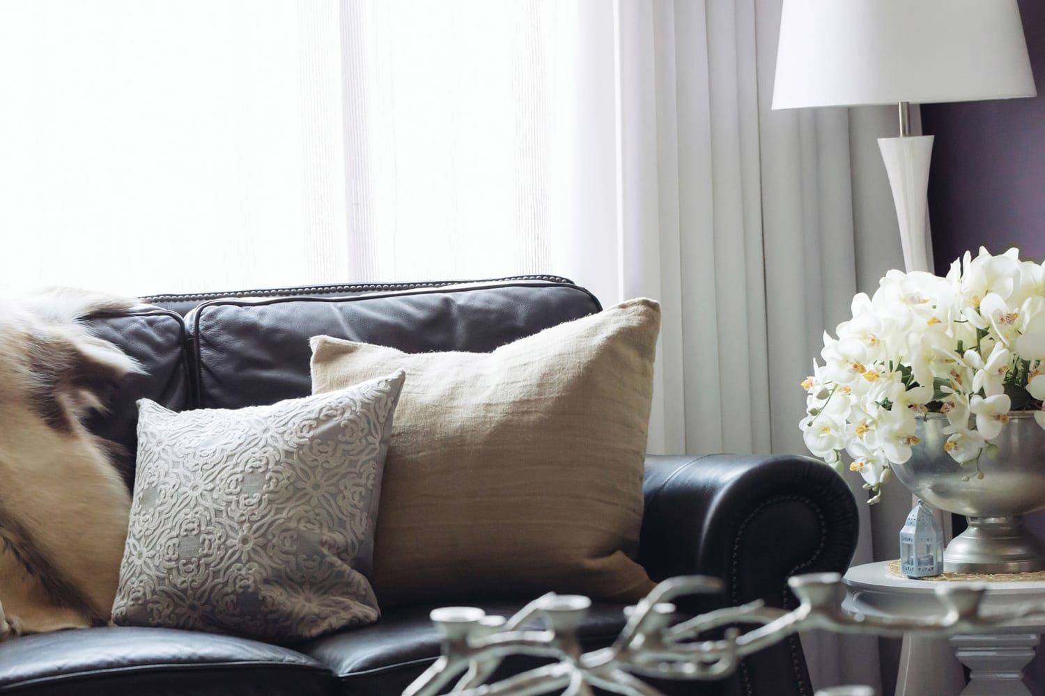 Living Room with cozy couch at Reserve at Centerra Apartment Townhomes in Loveland, CO