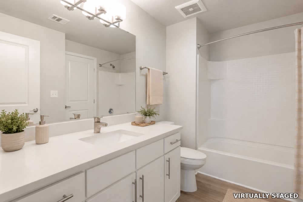 Bathroom with large mirror and bathtub at The Greens at Van de Water in Loveland, Colorado  