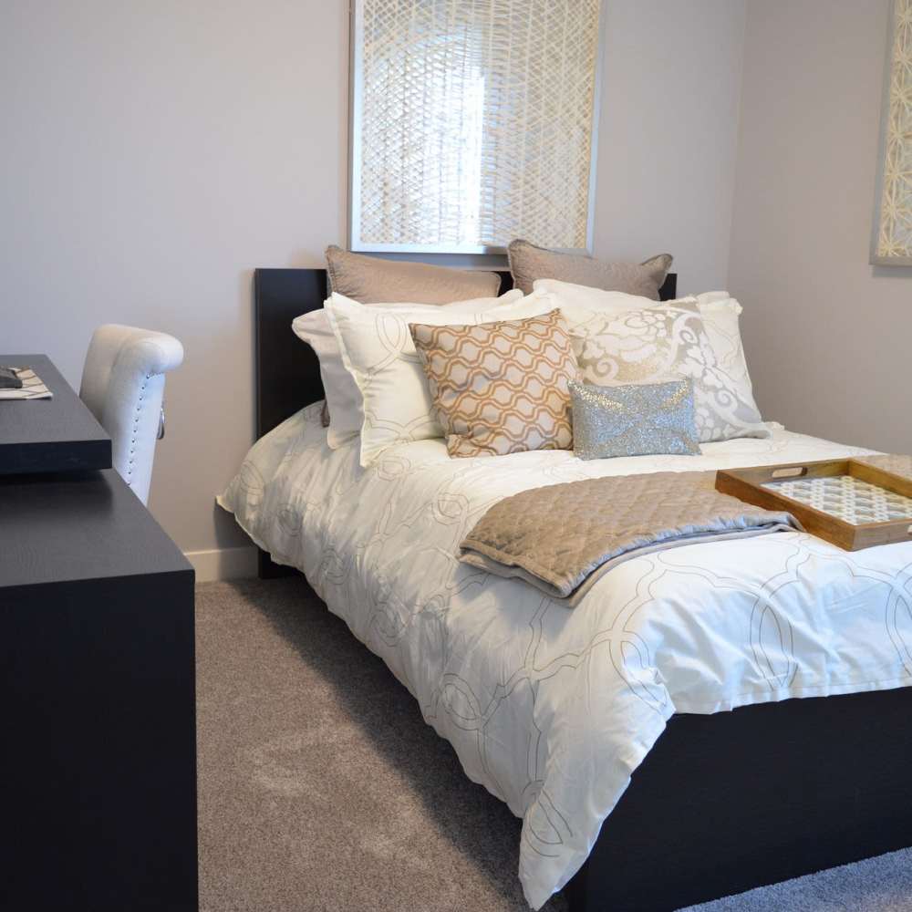 Bedroom with carpet flooring at Cross Timbers At Grand Street in Amarillo, Texas