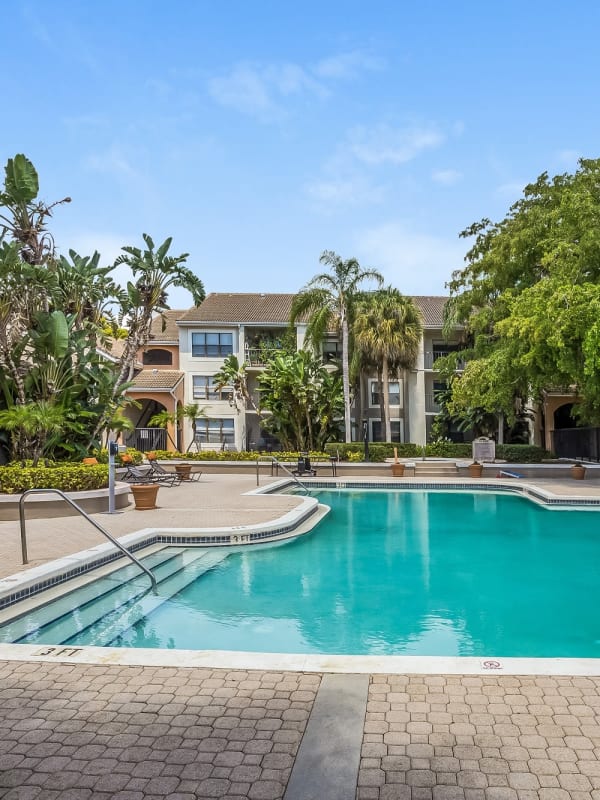 Resort-style swimming pool at Tuscany Pointe at Somerset Place Apartment Homes in Boca Raton, Florida