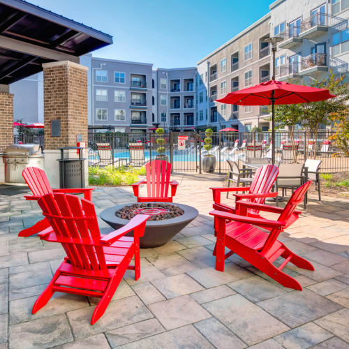Chairs around an outdoor firepit by the pool at The Carillon in Nashville, Tennessee