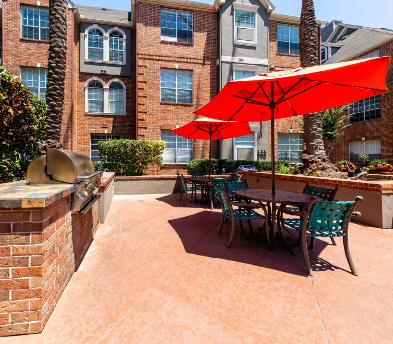 Patio with grills, tables, and chairs at Marquis on Pin Oak in Houston, Texas