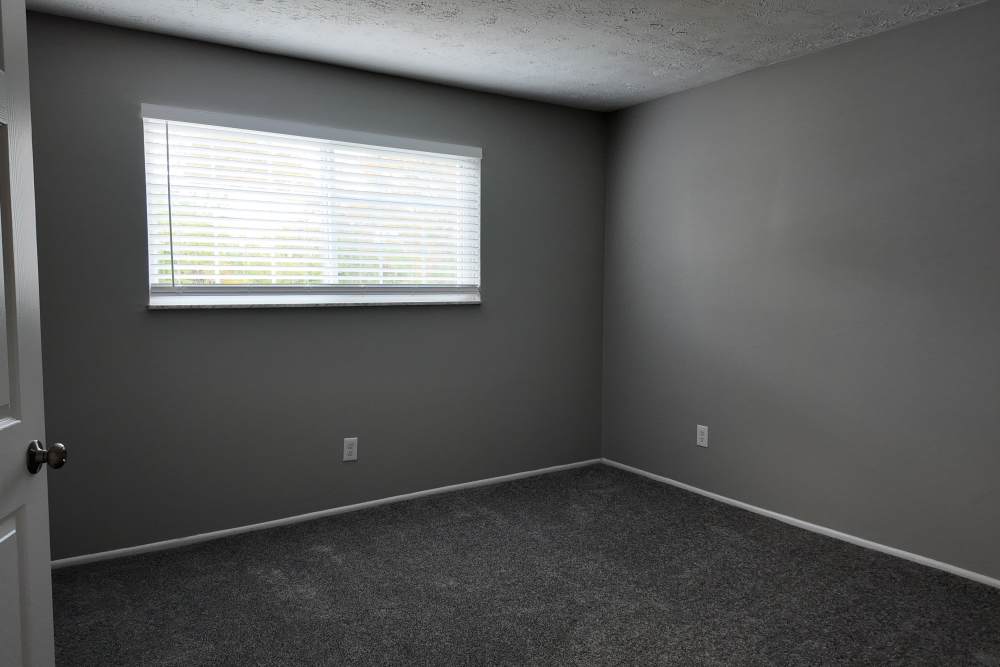 Unfurnished bedroom with carpet flooring at Pike Place KY in Highland Heights, Kentucky