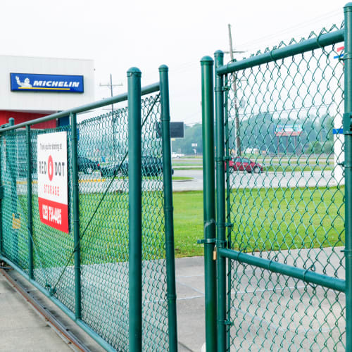 Green electronic entry gate at Red Dot Storage in Port Allen, Louisiana