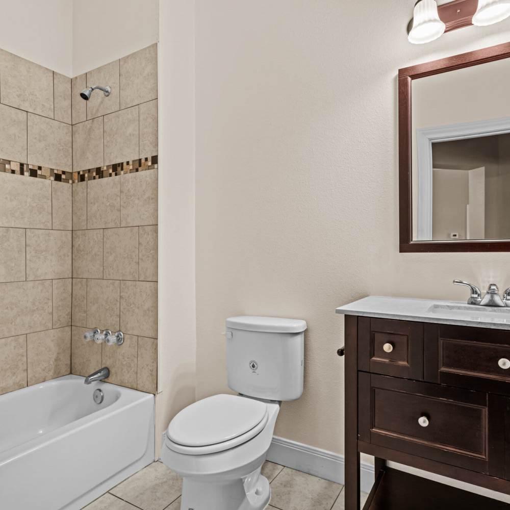 Bathroom with mirror at The Arbors of Mineola in Mineola. TX