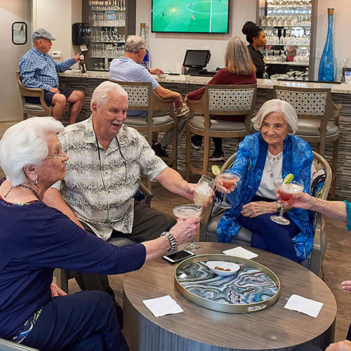 Residents enjoying a beverage together in the bistro at Bartlett Reserve in Durham, North Carolina