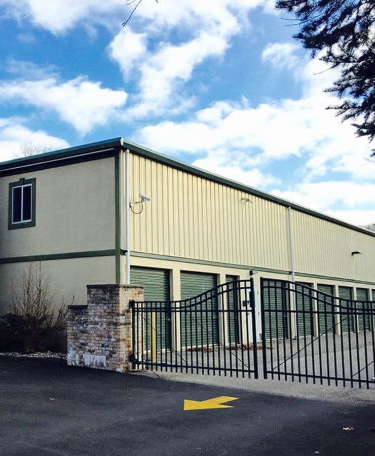 Exterior of the main entrance with electronic gate access to StorQuest Express Self Service Storage in Briarcliff Manor, New York