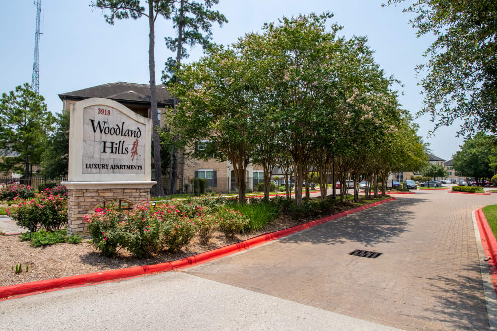 exterior of building with balconies at Woodland Hills in Humble, Texas