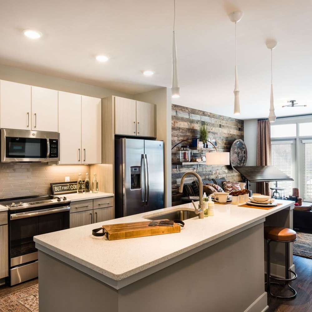 Kitchen with stainless steel appliances at Siena Suwanee Town Center in Suwanee, Georgia
