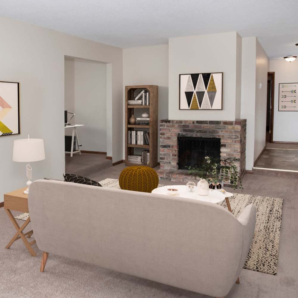 Living room with couch and fireplace at Bass Lake Crossing in New Hope, Minnesota