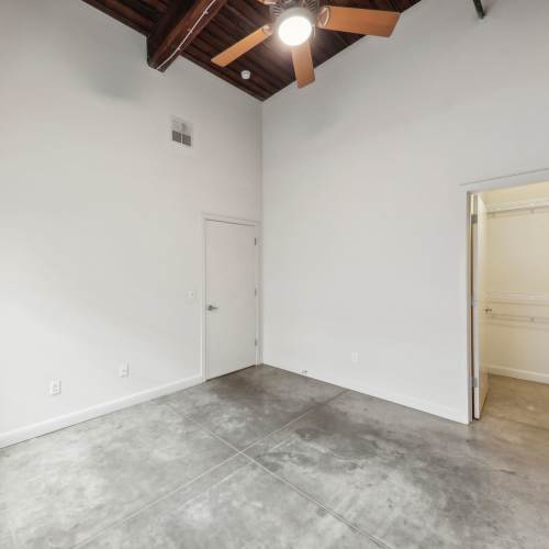 Unfurnished bedroom with walk-in closet at Stadium Loft Apartments in Saint Louis, Missouri