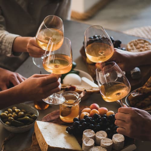 Residents enjoying some wine and appetizers on their private patio at The Mallory in Raleigh, North Carolina