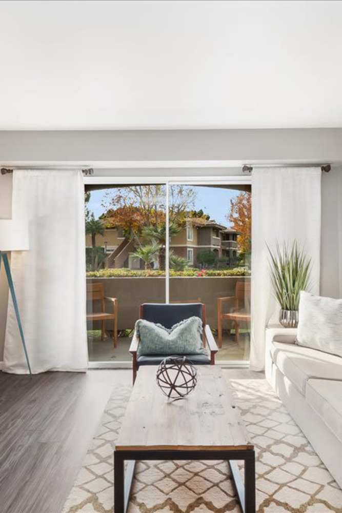 Living room with door to private balcony at Mirabella Apartments in Bermuda Dunes, California