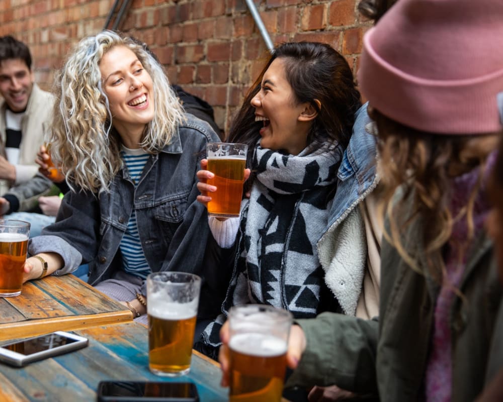 Residents chatting over drinks at Wellington Point in Atlanta, Georgia