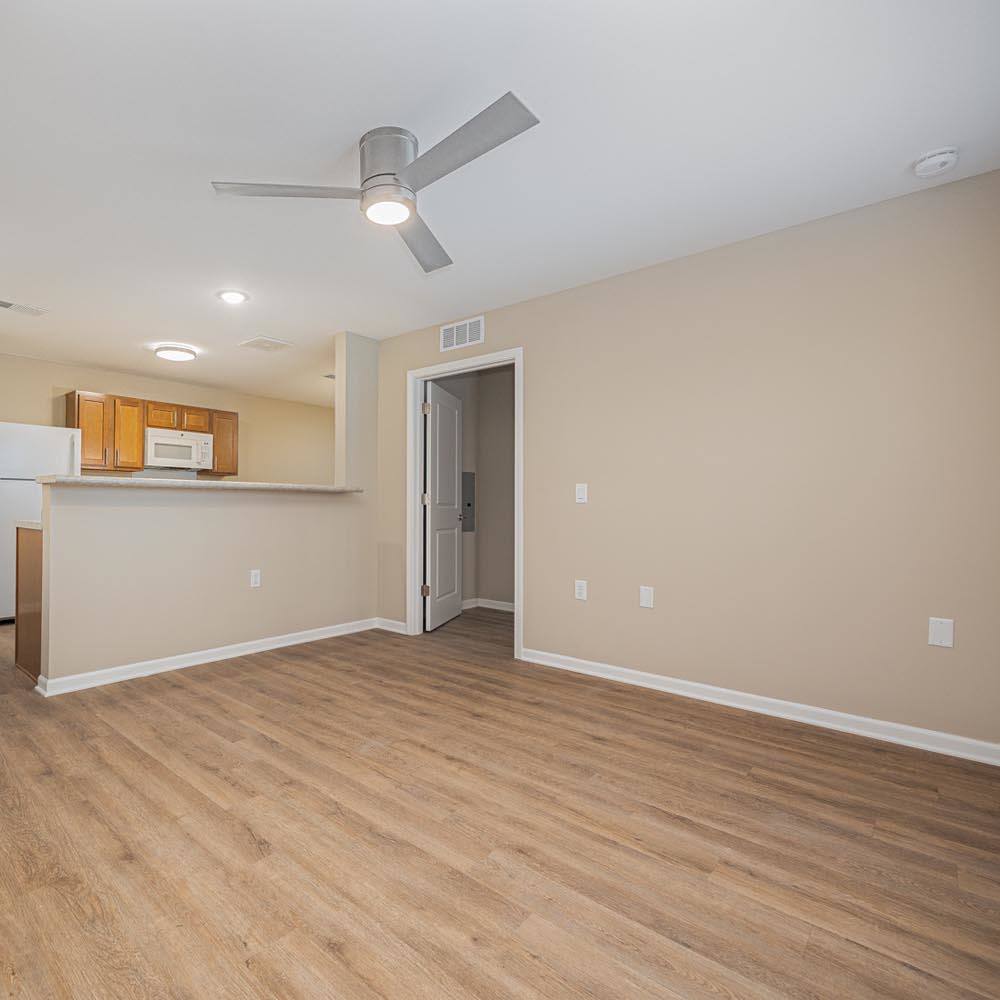 Charming living room with a ceiling fan at The Enclave on Main in Whitehall, Ohio