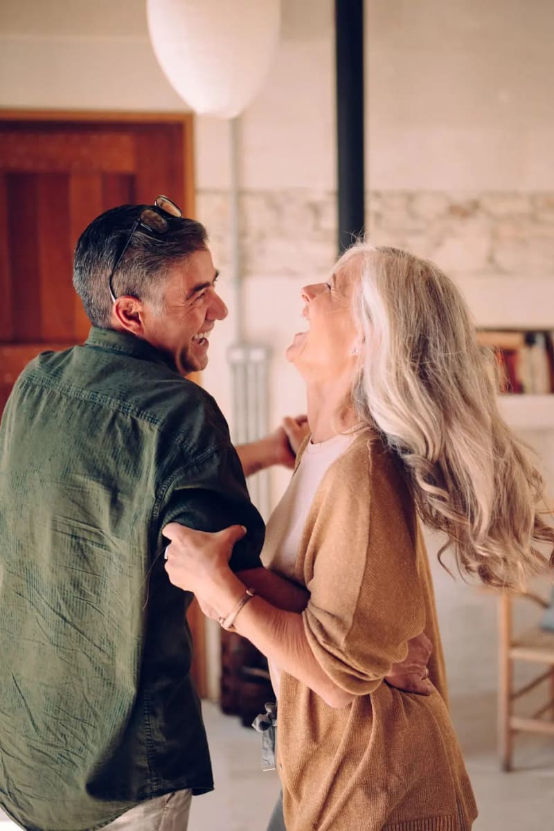 Resident couple dancing at Carriage Inn Katy in Katy, Texas
