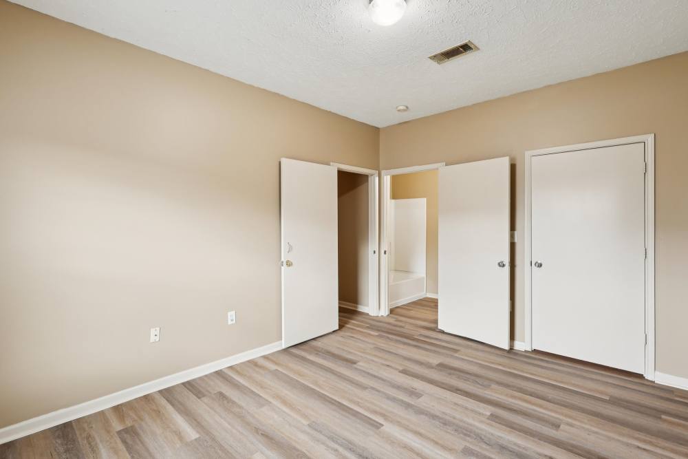 Master bedroom with closet and access to bathroom at Camden Park in Canton, Mississippi