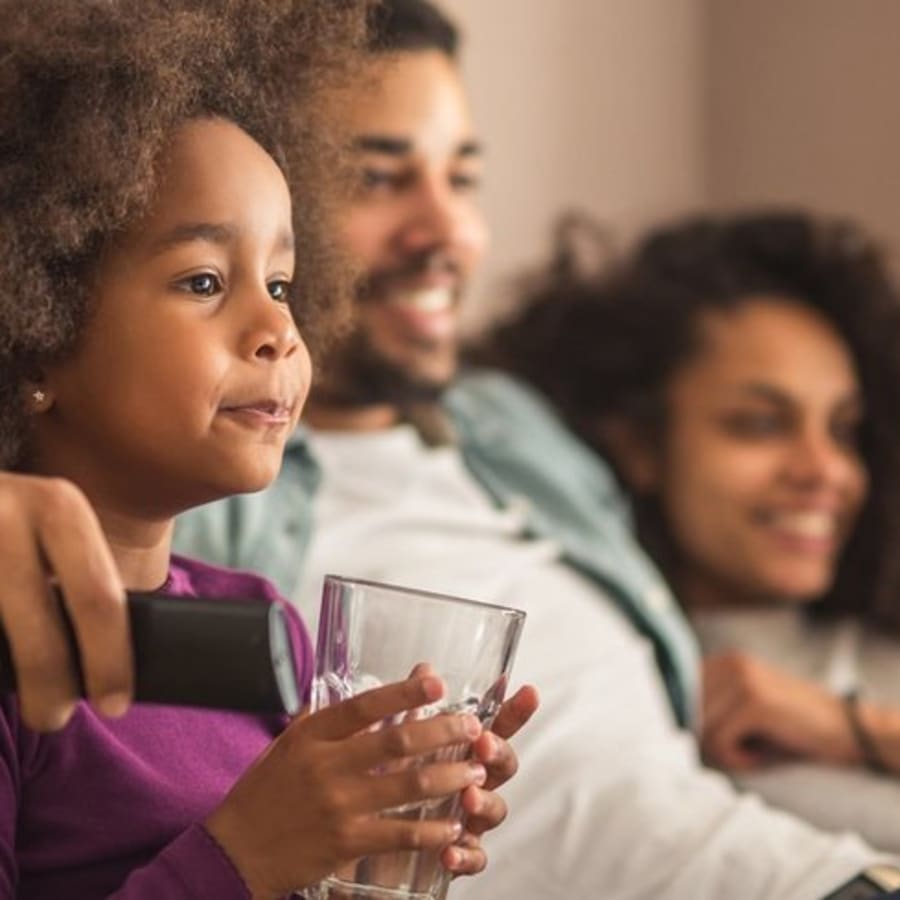 family watching a movie at Palms at Cinco Ranch in Richmond, Texas