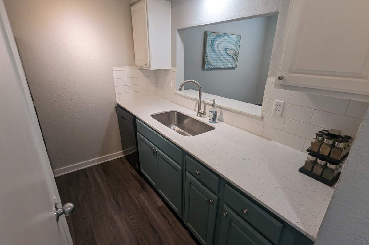 Modern kitchen with stylish cabinetry and gleaming countertops at Sangria Park in Austin, Texas.