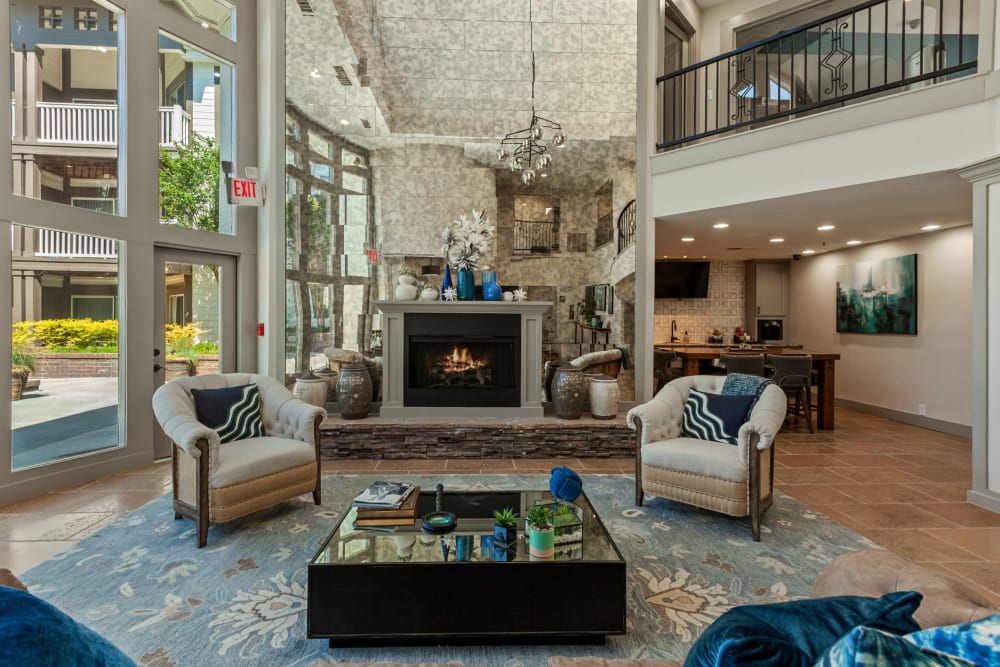 Spacious clubhouse area with a fireplace at 45Eighty Dunwoody Apartment Homes in Dunwoody, Georgia