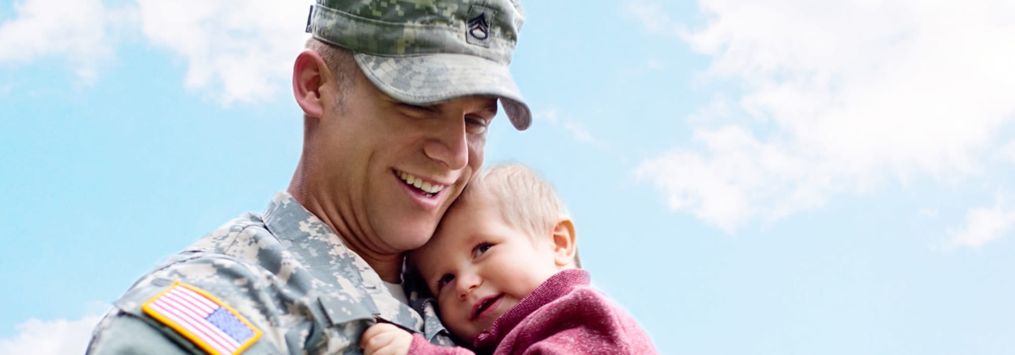 a resident holding his infant at El Centro (NAF) in El Centro, California