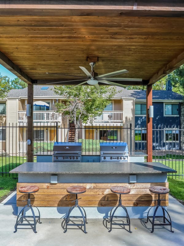 Seating near the barbeques at City Center Station Apartments in Aurora, Colorado