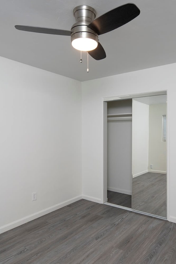 Ceiling fans and wood style flooring at Ocean Palms Apartments, San Diego, California