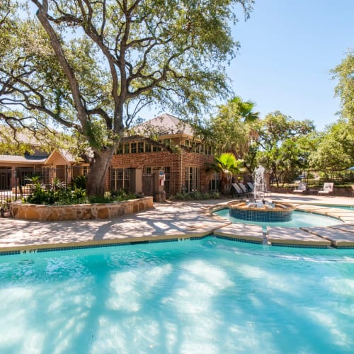 Cold beverage sitting next to the refreshing pool at Sonterra Heights in San Antonio, Texas