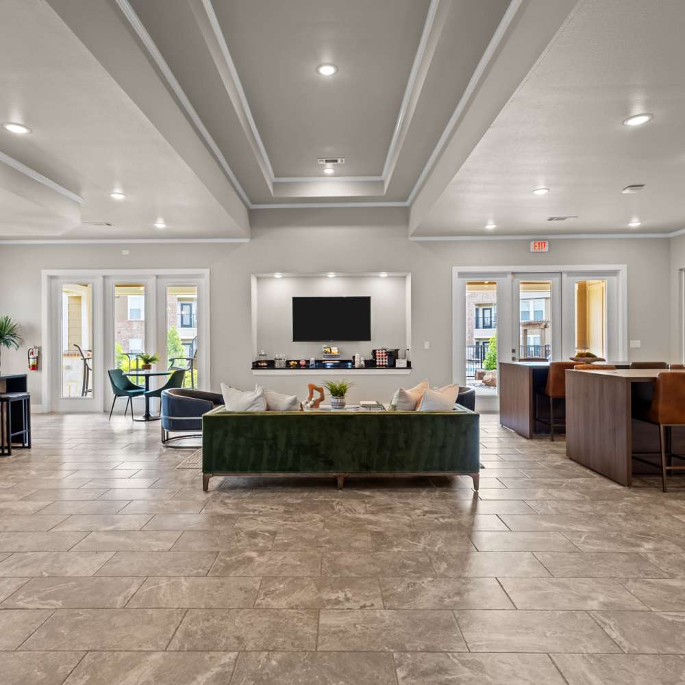 Clubhouse with seating apaces and flat screen television at Deer Park in Athens, Texas