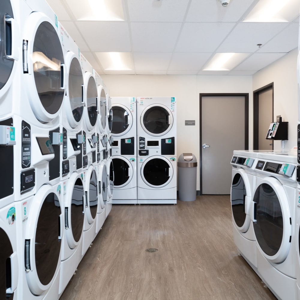 Clean, modern laundry center at Golden West Tower Apts in Torrance, California