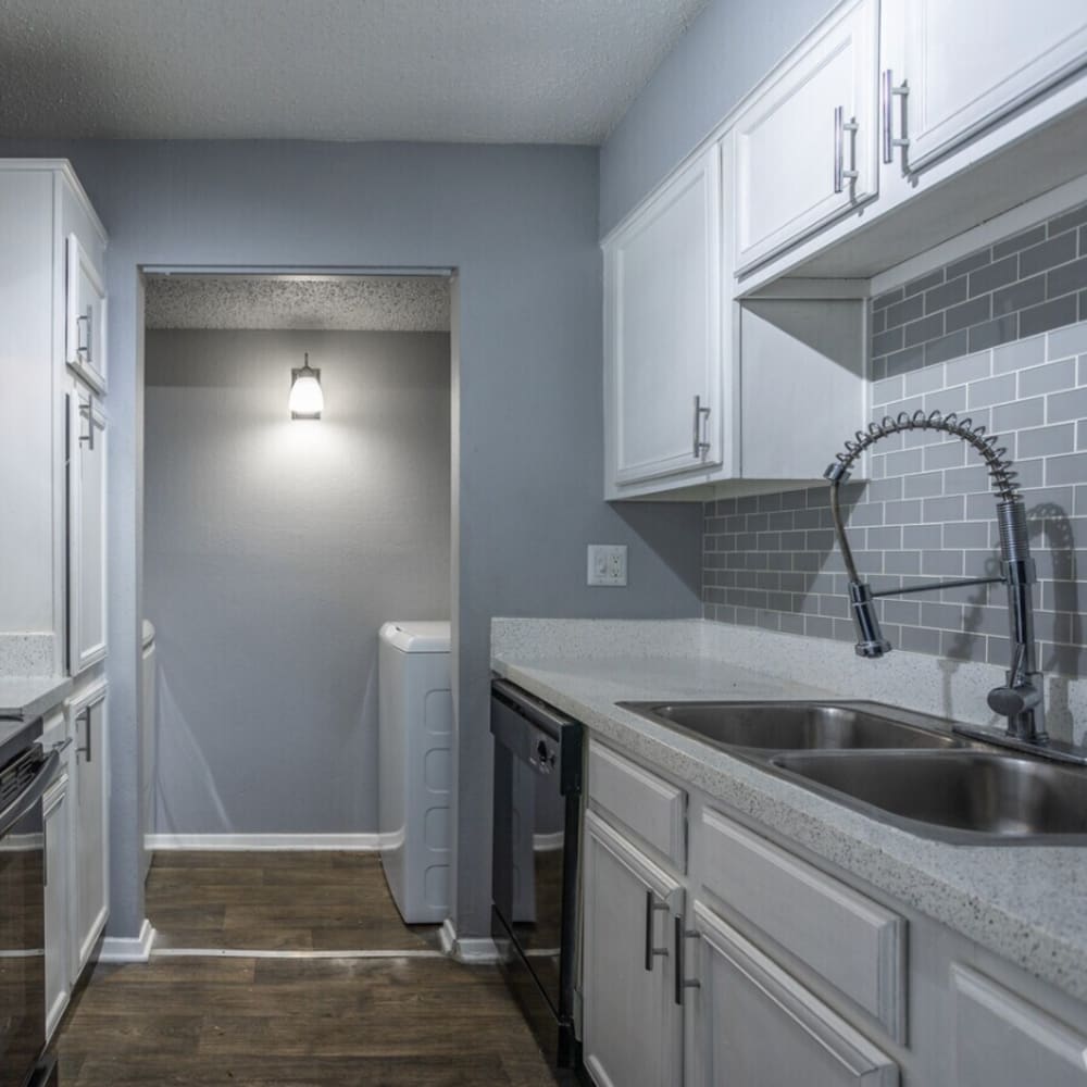 Kitchen with white appliances at Eleven600 in Dallas,Texas