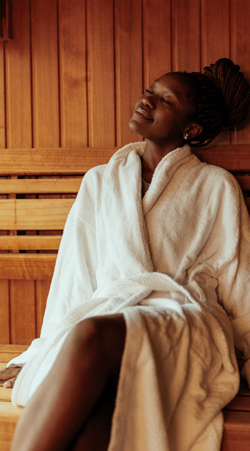 Woman sitting on the edge of the pool at Residences at 111 Lyon in Grand Rapids, Michigan