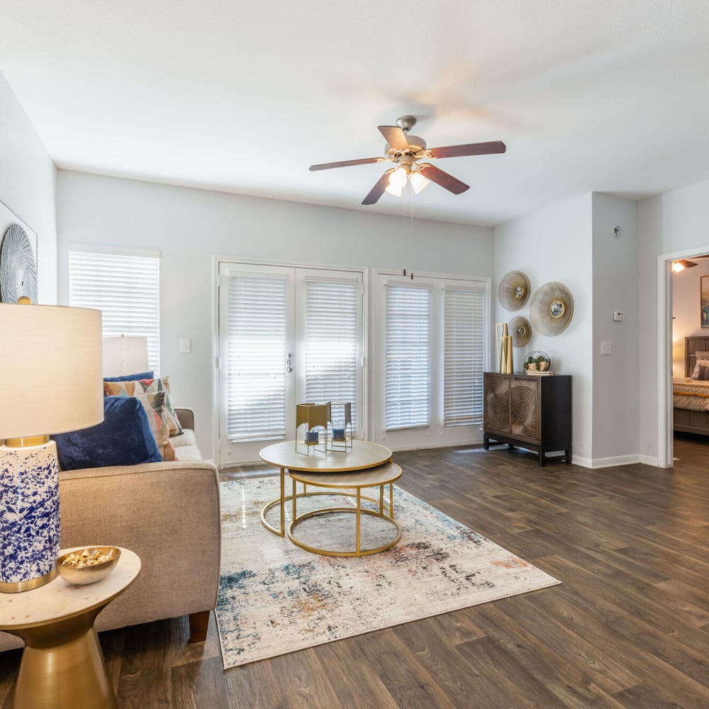 Open living space with wood-style flooring at The Gentry in Houston, Texas