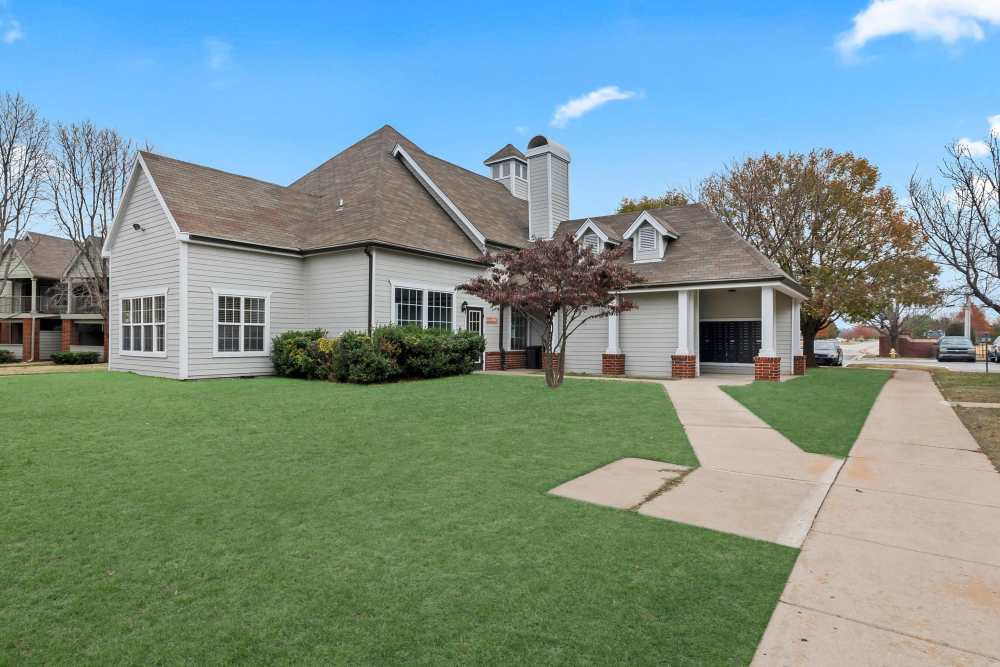 Community exterior with green lawn at Garden Courtyards in Tulsa, Oklahoma