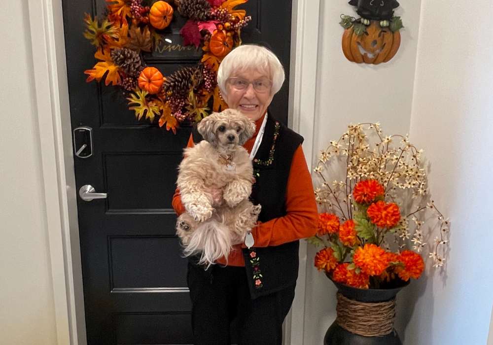 Resident holding her puppy at Mission Ridge in Springfield, Missouri