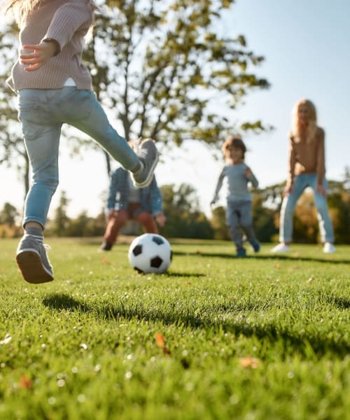 Kids playing soccer at a park near Clearleaf Crossing in Bryan, Texas