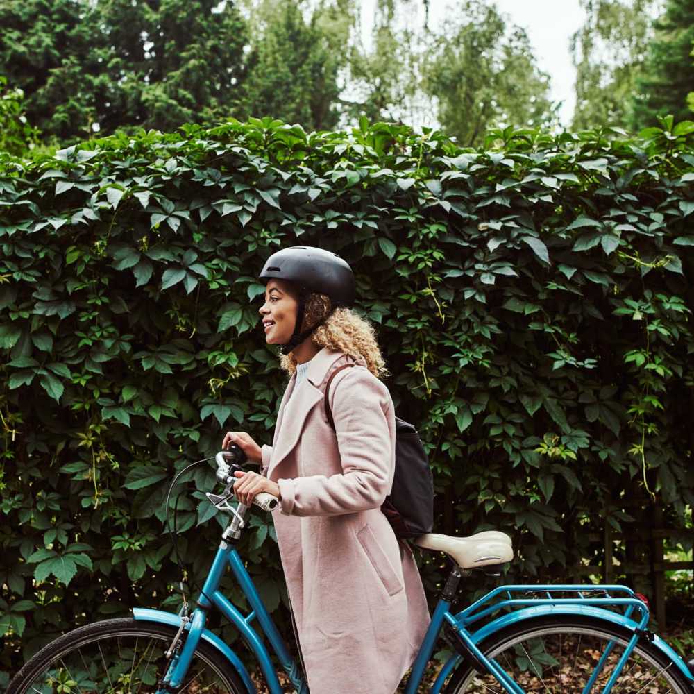 Resident cycling near Sycamore Heights Townhomes in Tontitown, Arkansas