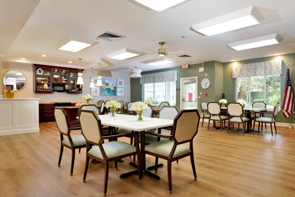 Wooded floor room with chairs and tables at The Commons at Union Ranch in Manteca, California