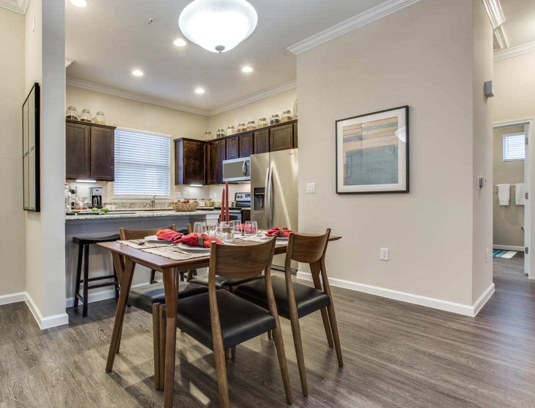 Avilla Premier showcases a beautiful kitchen and dining room in Plano, Texas