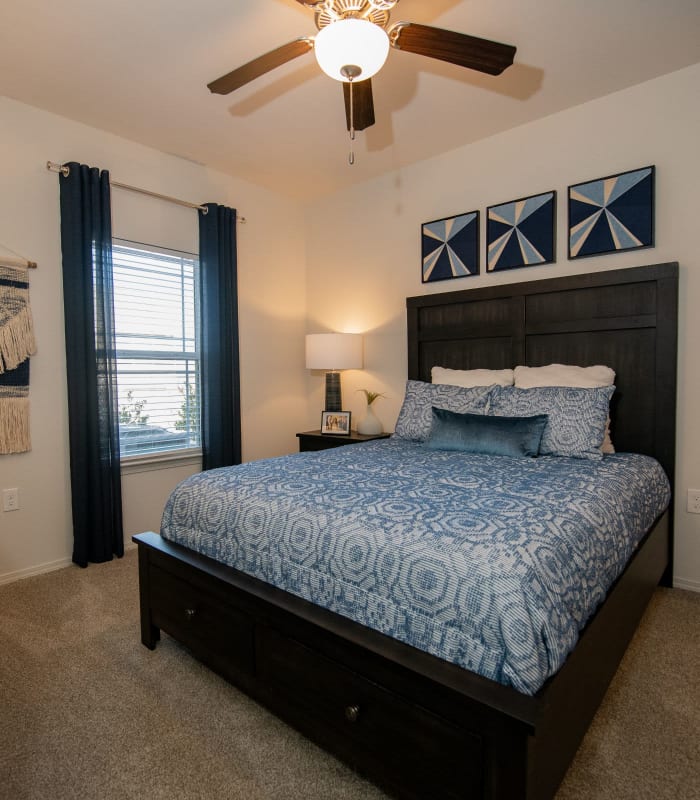 Spacious carpeted bedroom at Center 301 Apartments in Belton, Missouri