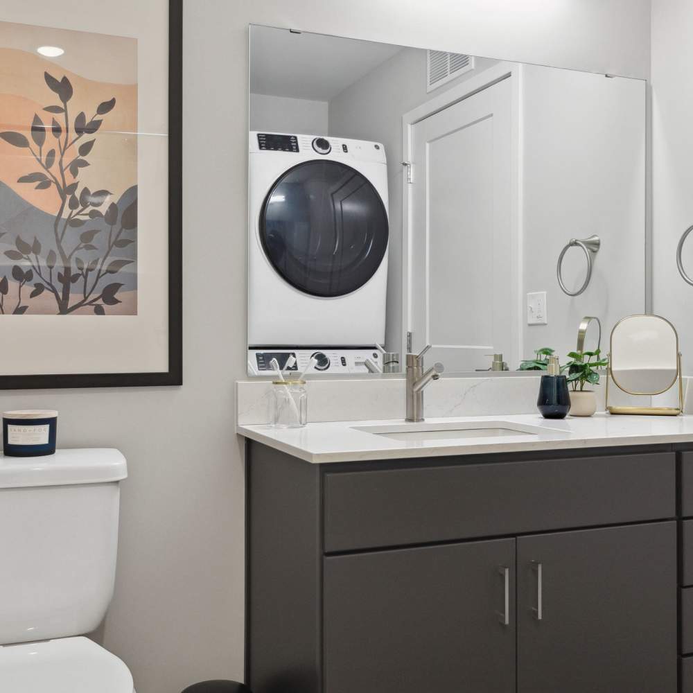 Bathroom with stackable washer and dryer at Oaks Pentagon Village in Edina, Minnesota