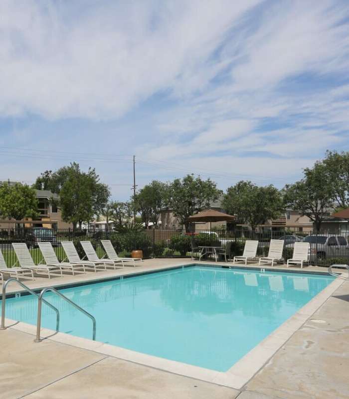 Swimming Pool with lounge beds at The Willows in Escondido, California