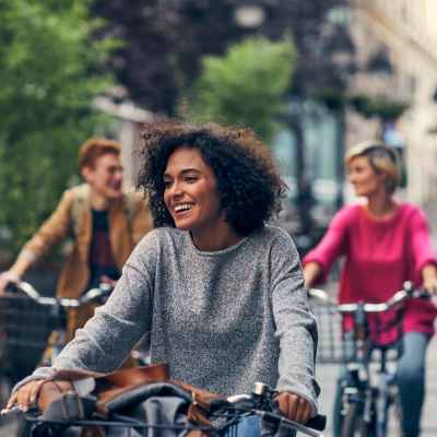 Residents riding bikes in the neighborhood near The Bergamot Apartments On 780 in Sarasota, Florida