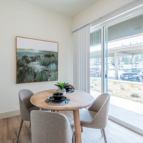 Dining table near the door to the patio at Towne Centre Apartments in Lathrop, California