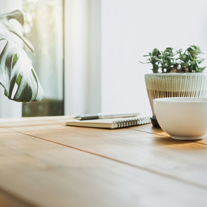 A table with a cup of coffee in an apartment at Acclaim at Cary Pointe, Cary, North Carolina