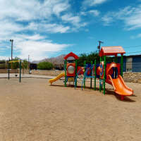 Playground with sliders  at Agave Courtyard in El Paso, Texas  