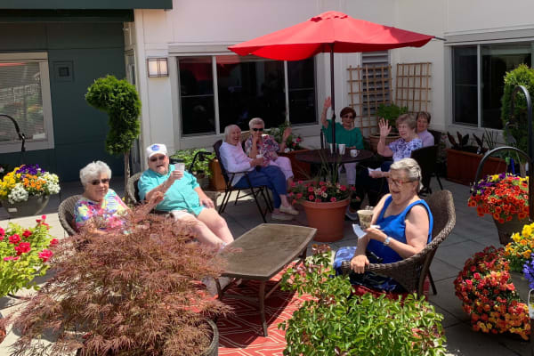 Residents enjoying a patio at Merrill Gardens at Tacoma in Tacoma, Washington. 