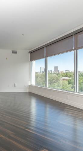 Living room with a large window at The View at Wash Park in Denver,Colorado